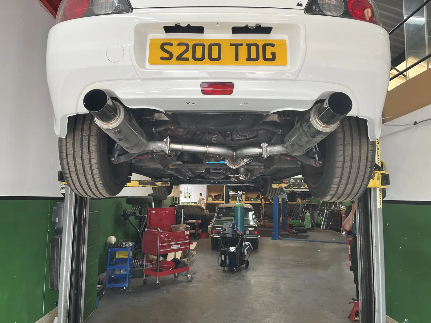 Car on workshop ramp for inspection at Goblin Automotive