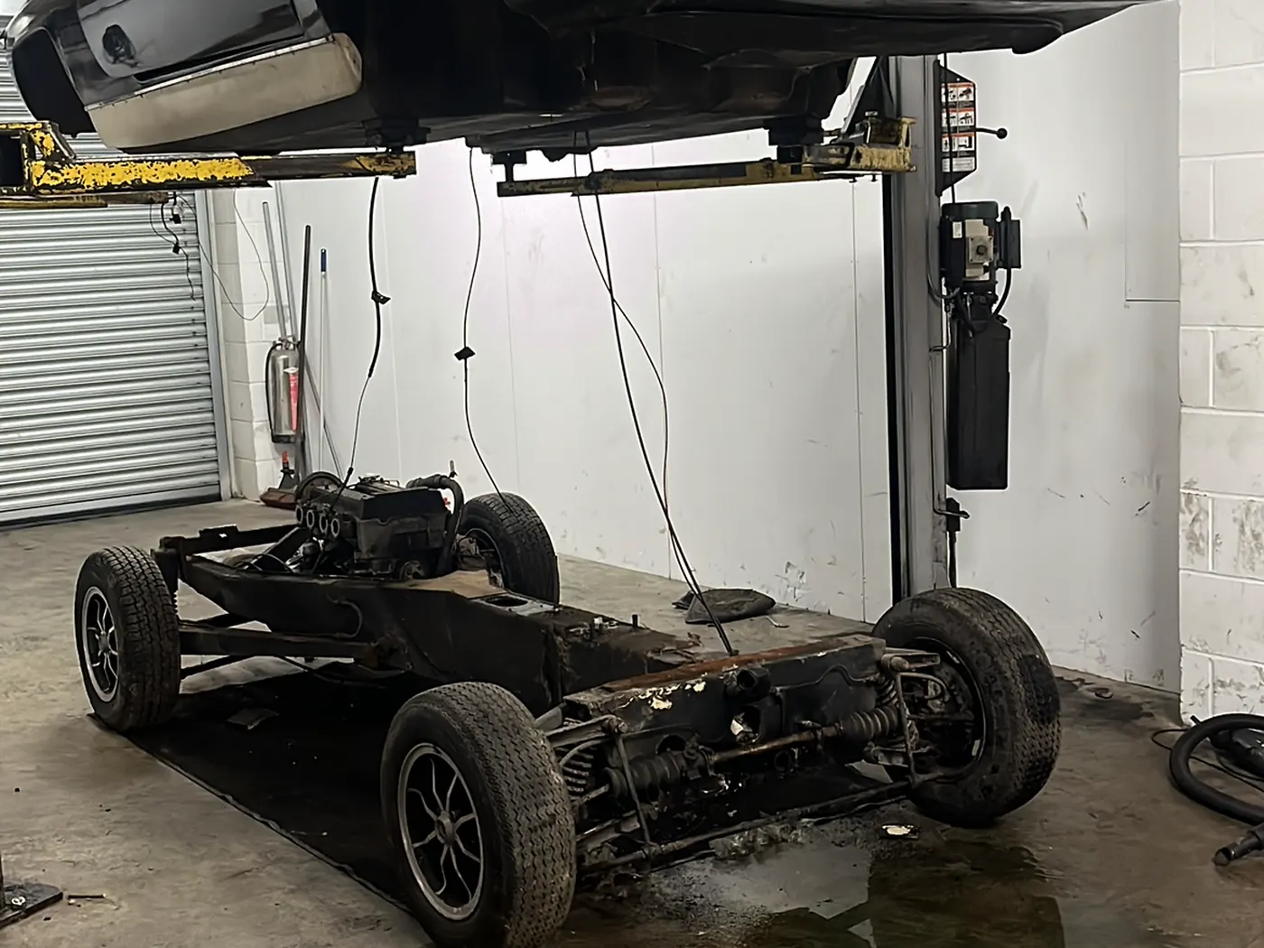 Lotus chassis stripped to rolling shell during restoration at Goblin Automotive