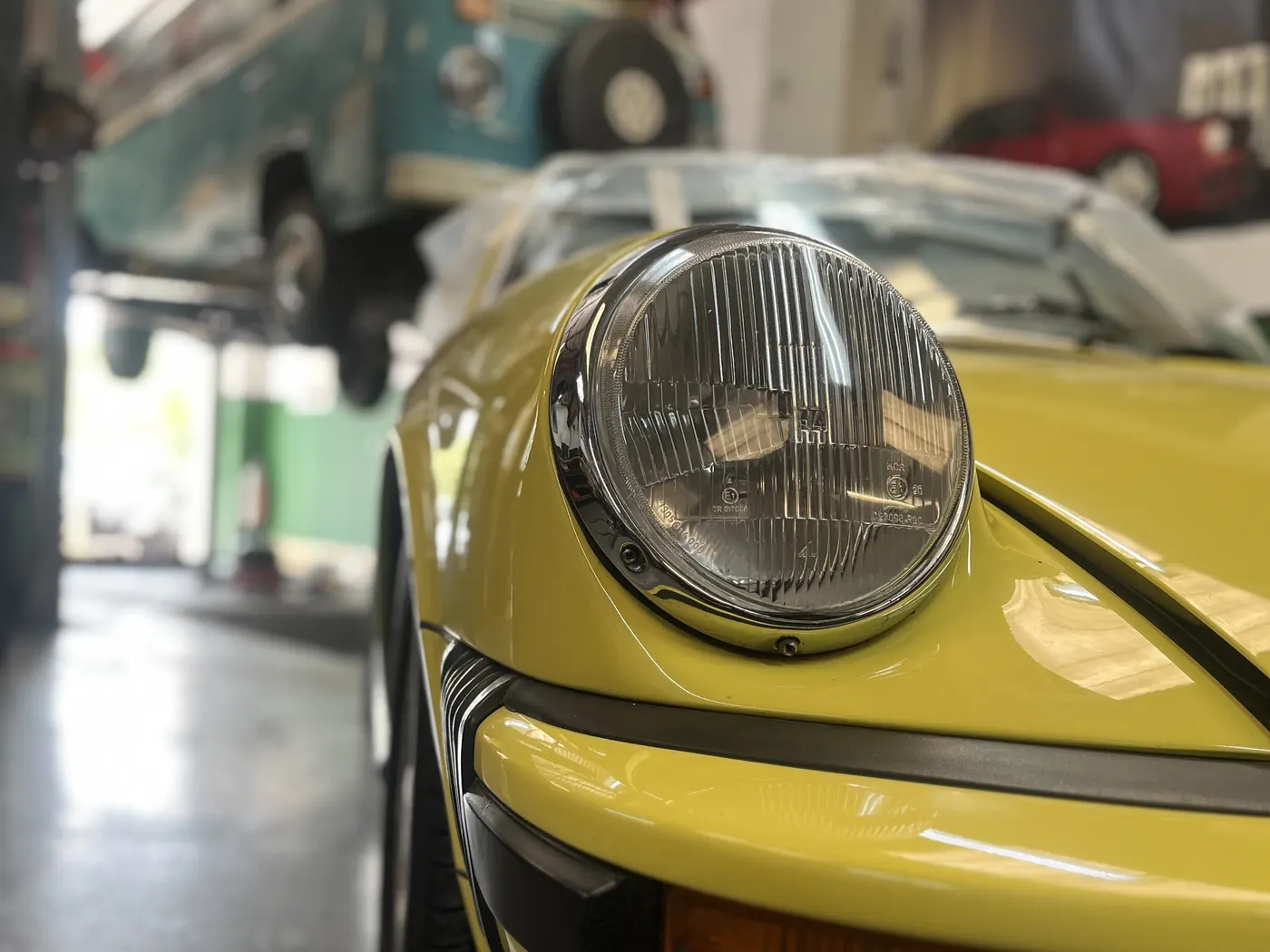 Yellow Porsche 911 in the workshop at Goblin Automotive